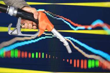 oil pump nozzle and stock chart background