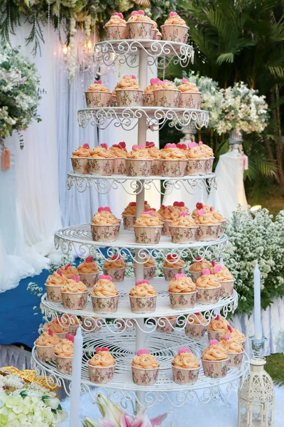 orange cup cake on stand