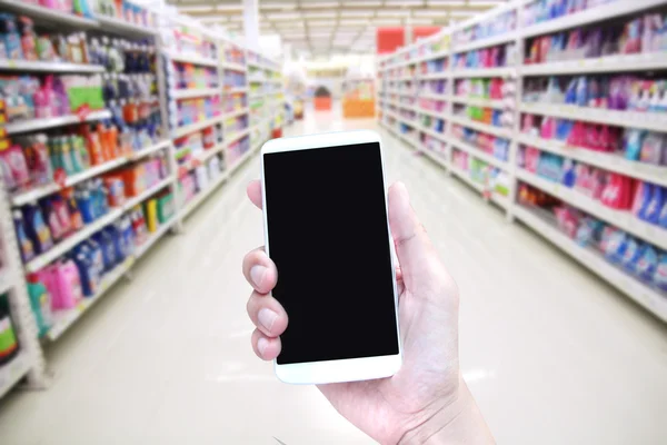 Hand Hold Smartphone Supermarket Background — Stock Photo, Image