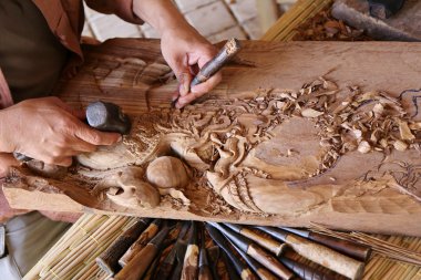craftsman carving wood, thai art clipart