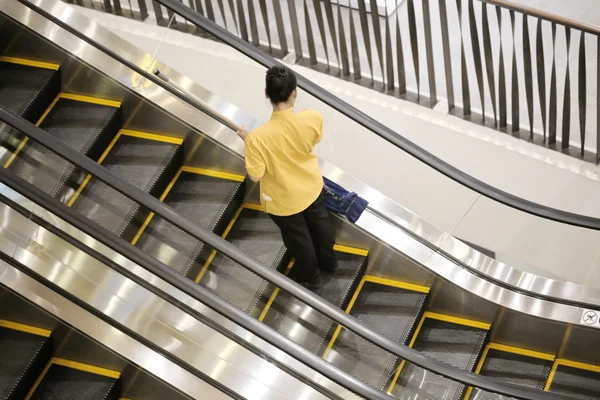 Maid Cleaning Escalator — 스톡 사진