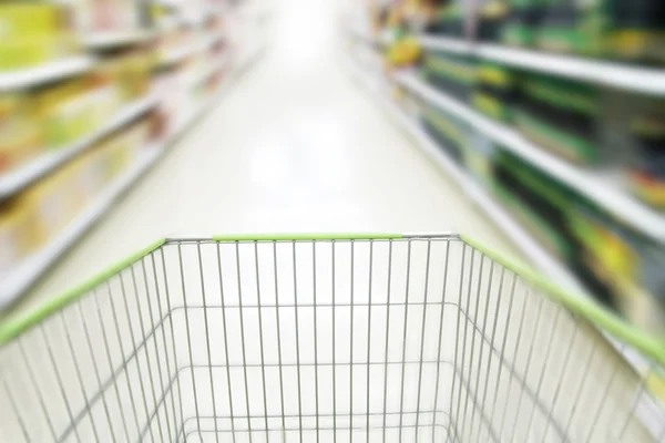 Blurred supermarket cart — Stock Photo, Image