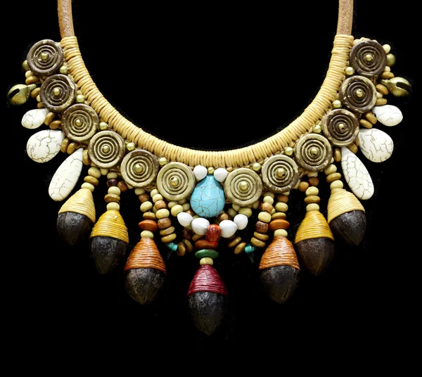 Wood stone necklace on black — Stock Photo, Image
