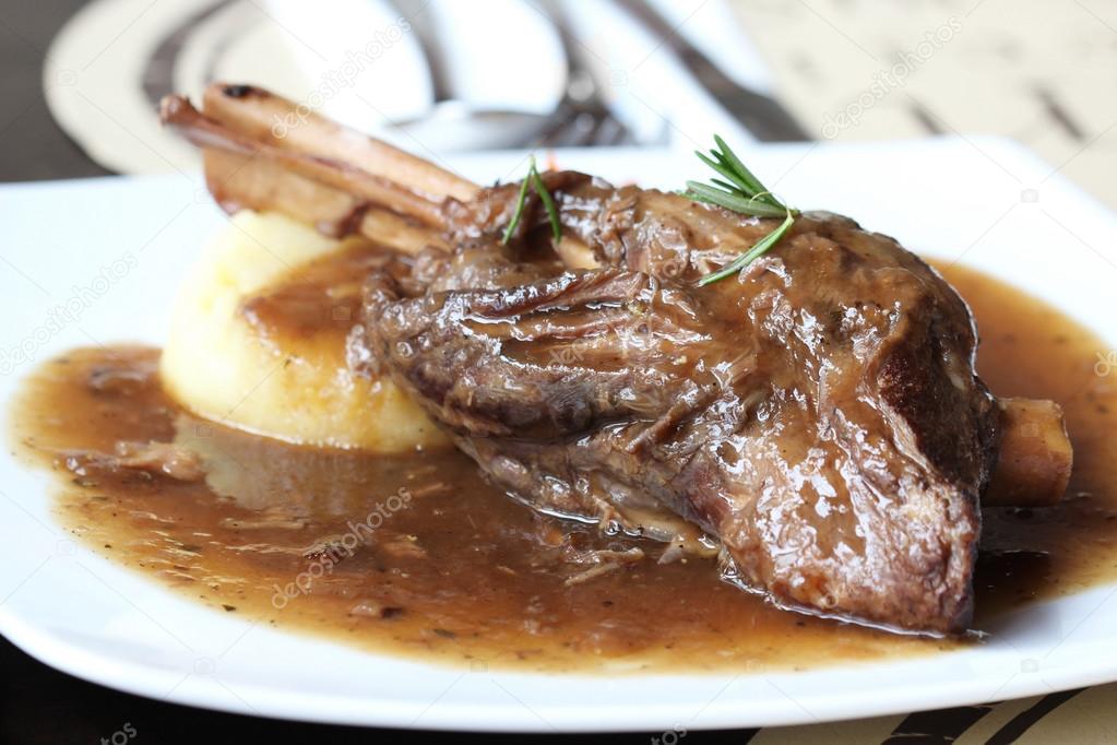 Braised lamb shank in mint and rosemary gravy