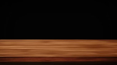 Parıldayan koyu yeşil ve siyah-yeşil arka planın önündeki boş ahşap masa. Işık ve sızıntı etkisi. HD görüntüler