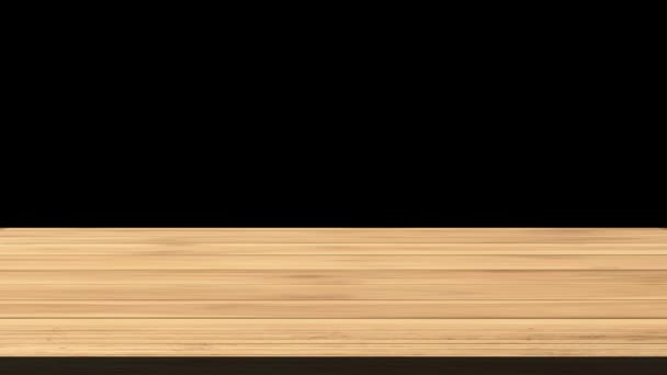 黑色和橙色背景前的空木板桌子 光和漏的效果 Hd镜头 — 图库视频影像