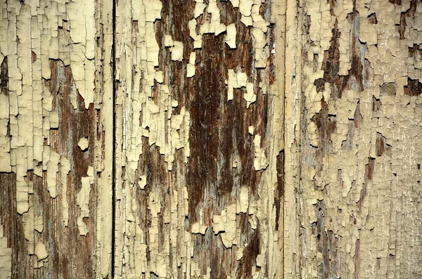 Peeling paint on grunge wooden surface — Stock Photo, Image