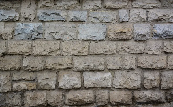 Πέτρινο τοίχο με αφηρημένες μοτίβο — Φωτογραφία Αρχείου