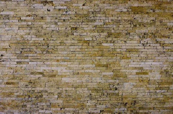 Steinmauer mit abstrakten Mustern — Stockfoto