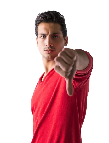 Handsome young man doing thumb down sign — Stock Photo, Image