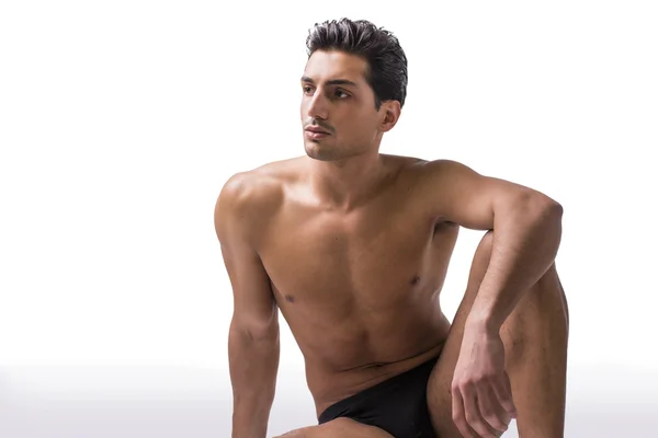 Handsome latin young man sitting naked on floor — Stock Photo, Image