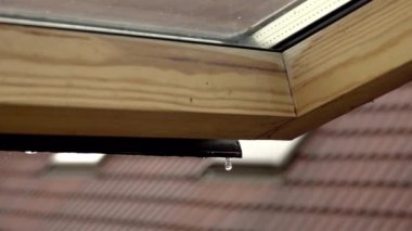 Heavy rain pouring on a building roof
