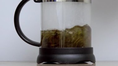 Making tea in a teapot and waiting to be ready. Timelapse