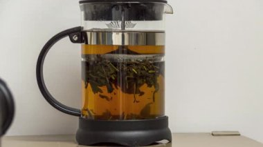 Making tea in a teapot and waiting to be ready. Timelapse