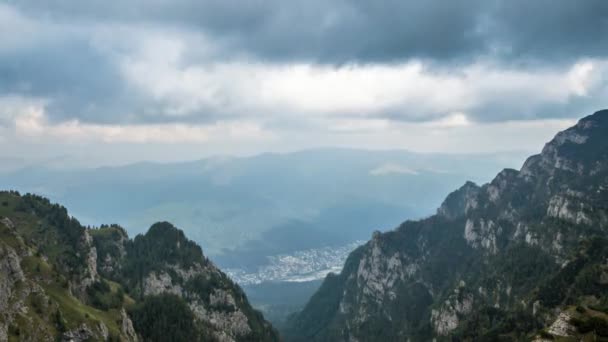 City under cloudy sky, view from mountain peak — Stock Video