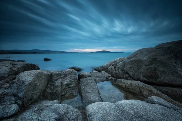 Long exposure seascape in the blue hour before sunrise