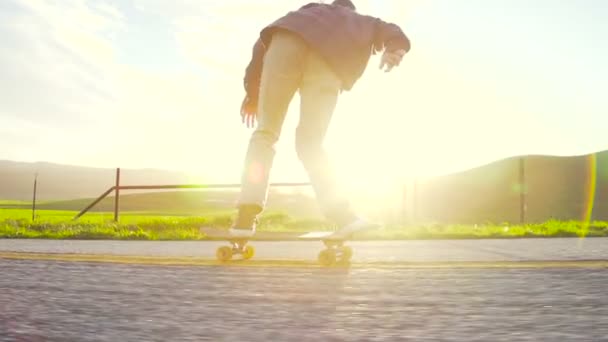 Slow Motion Young Hip Man Skating Downhill Sunset — Stock Video