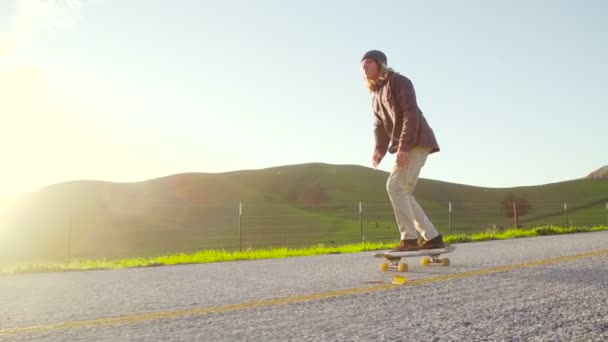 Slow Motion Young Hip Man Skating Downhill Sunset — Stock Video