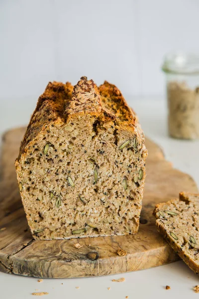 Rectangular loave of bread, traditional sourdough bread on light background. Concept of traditional leavened bread baking methods. Healthy food.