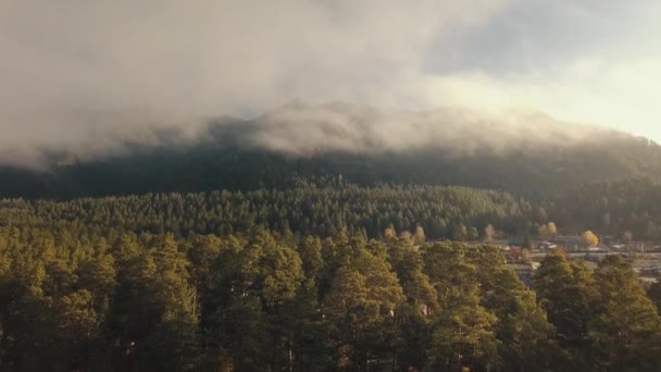 Aerial sunrise view of mountain Cheposh village valleys with forest through clouds in the morning. The Altai Republic and the Altai Krai of Russia — Stock Video