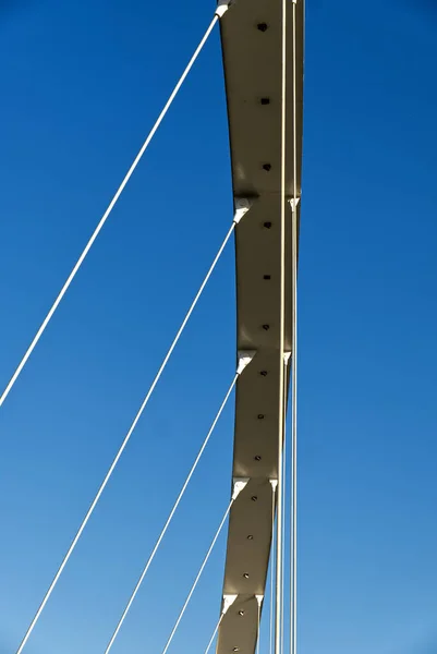 Abstract photo of the detail of the tie rods of a modern suspension bridge — Stock Photo, Image