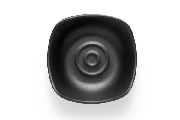 黑色陶瓷盘在白色背景上隔离 顶部视图 — 图库照片