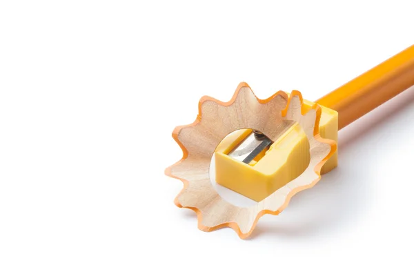 Pencil sharpener with yellow pencil — Stock Photo, Image