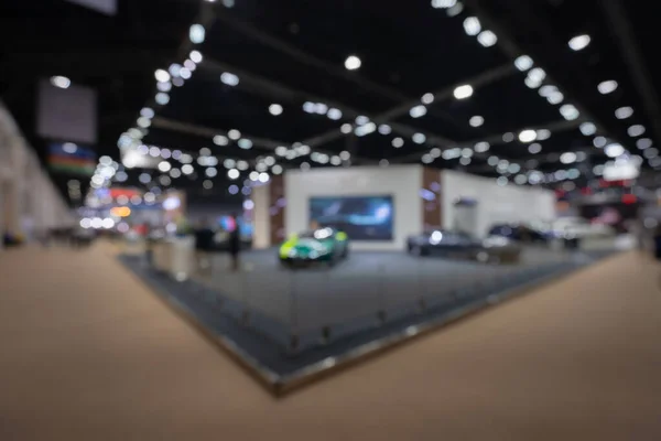 Abstract blurred image of people in cars exhibition show including activities and innovative automotive exhibitions at display in 42th Bangkok International Motor Show 2021 Nonthaburi, Thailand. Blurred for background concept.