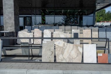 Marble tombstones for monuments for sale near the cemetery. Russia, Krasnoyarsk, badalyk Cemetery, - October 21, 2020. clipart