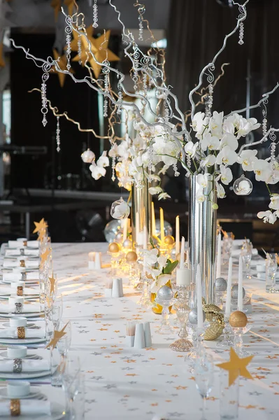 Festive table decorated with candles — Stock Photo, Image