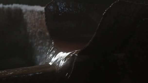 Water stream flows from metal pipe with steam in winter — Stock Video