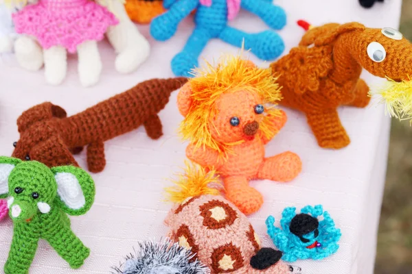 Knitted toys at fair of different handicrafts at fair — Stock Photo, Image