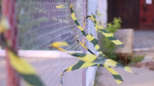 Metal net with waving ribbons outdoor at summer day — Stock Video