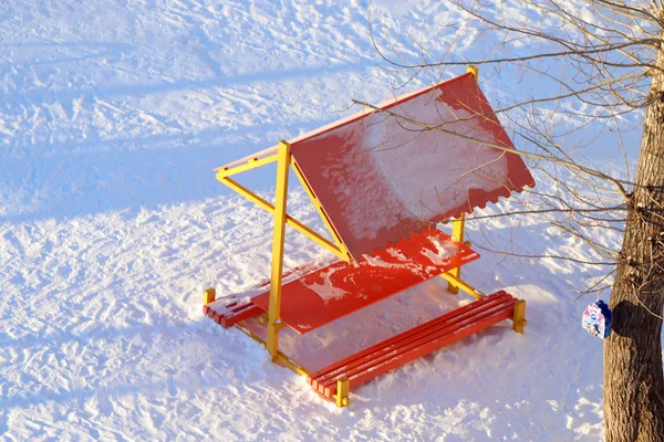 Top view wooden arbor at children playground covered by snow — Stock fotografie