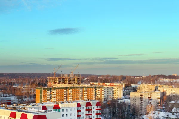 Residential area with buildings in snow at sunny winter evening — Stock Photo, Image
