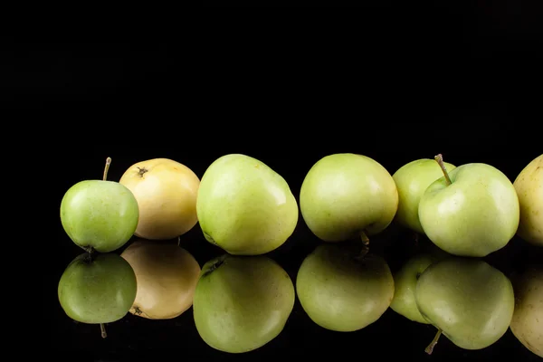 Summer green apples on a black background — Stock Photo, Image