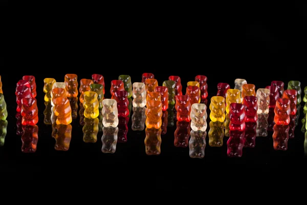 Army rubber teddy bears on a black background — Stock Photo, Image