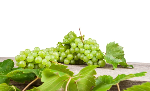 Uva, vino bianco su un tavolo di legno — Foto Stock
