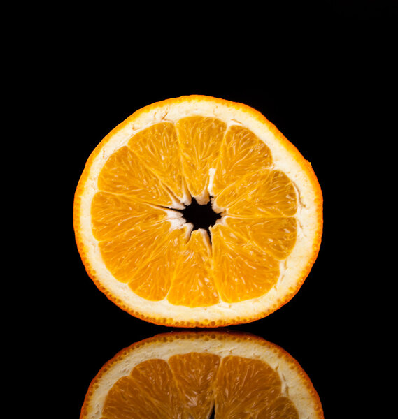 Orange fruit isolated on a black background