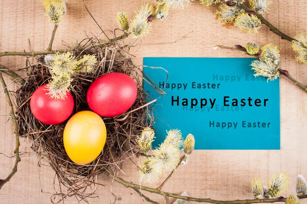 Easter card with an inscription on a wooden background — Stock Photo, Image