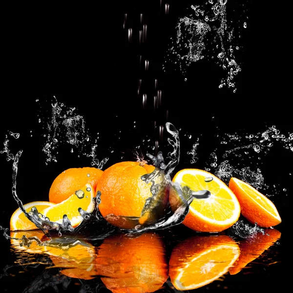 Orange fruits and Splashing water