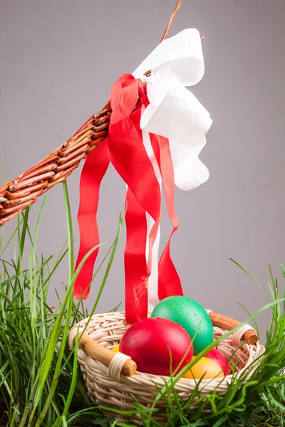 Easter basket with colored eggs — Stock Photo, Image