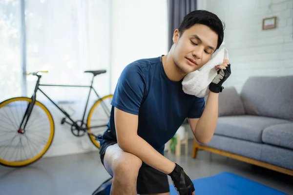 Asian Man Feeling Tired Wiping Face Towel Training Home Living — Stock Photo, Image