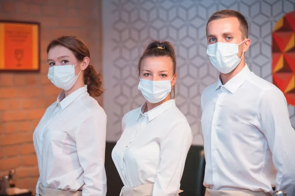 work of staff wearing medical masks during a pandemic