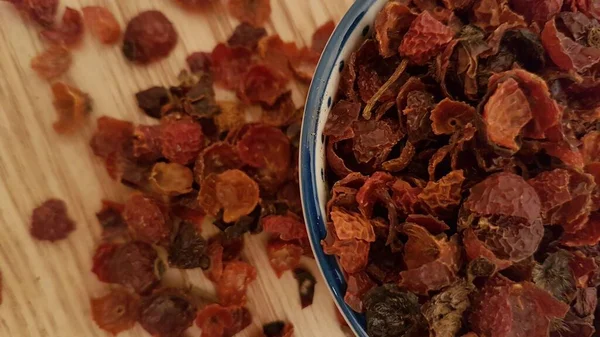 Close up of dried rose hip for tea. These dried medicinal herbs are ready to be used in tea. Rose hip contains a lot of vitamin C and it is good for your immune system. It also works as a laxative so it has a positive effect on your digestion.