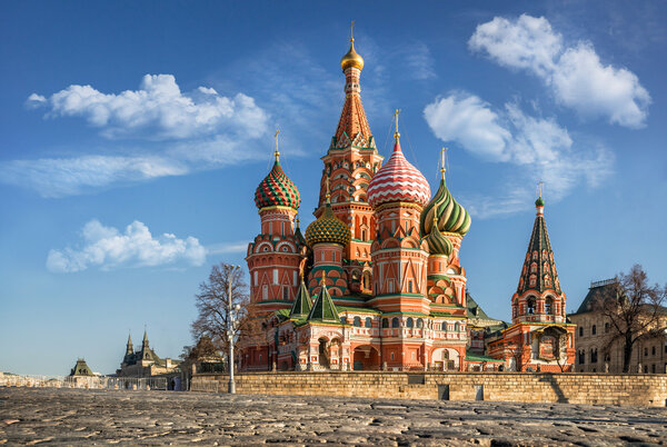 Colorful St. Basil's Cathedral on Red Square under the blue sky and white clouds