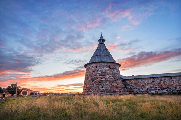 The White Tower of the Solovetsky Monastery against the backdrop of a beautiful sunset autumn sky