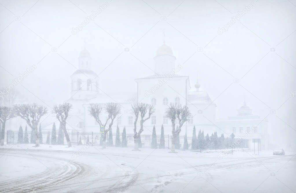 Ascension Monastery in a severe blizzard in Smolensk under a spring snowy sk