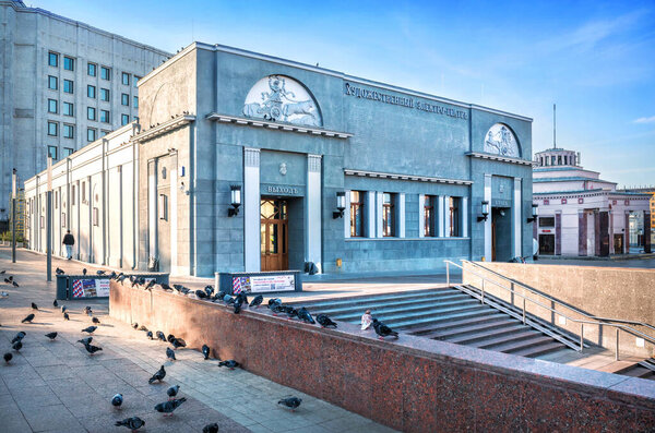 Art Electro-theater in Moscow and pigeons on a summer morning. Caption: Art Electro-Theate