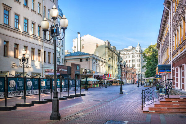 Houses and cafes and lanterns on the Arbat in Moscow on a summer mornin